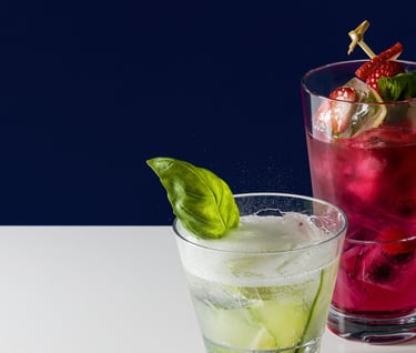 Product photography - two glasses of fruit juice with strawberries and cucumber