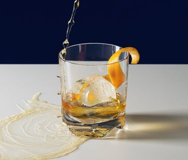 Product photography - a drink in a glass with an orange peel