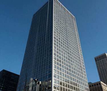High-contrast architectural photograph of a modern glass and steel skyscraper in Chicago, captured with extreme sharpness and deep blue sky tones, professional gear review sample, North American urban setting.