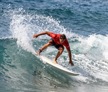 A high-speed action shot of a professional surfer on a wave, crisp details, frozen motion, bright natural daylight, North American coast, vibrant yet professional photography style.