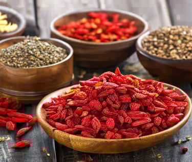 a variety of dried goji berries in bowls
