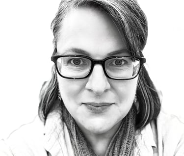 Smiling portrait of the artist behind She Who Creates Art