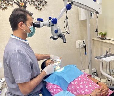 best micro-endodontist root canal specialist in mumbai doing painless root canal treatment with microscope