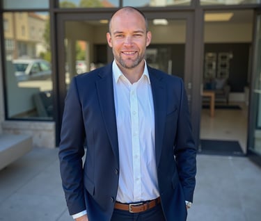 a man in a suit and a white shirt