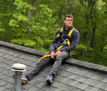 a man sitting on a roof top of a roof