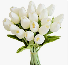 a bouquet of white tulips with green leaves