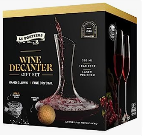 a wine decanter with wine glasses and a wine glass