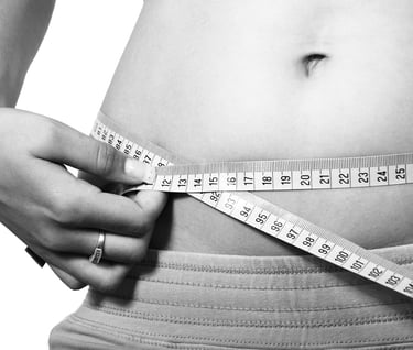 a woman's waist with a measuring tape measure tape around her waist