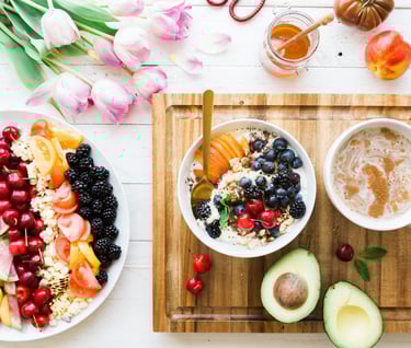 a variety of fruits and vegetables on a cutting board