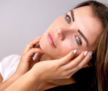 a woman with a white shirt and healthy skin due to alkaline water