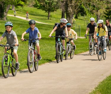 Woman leading group of people on bikes