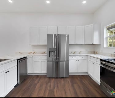 Custom kitchen featuring stainless steel fridge and modern cabinetry