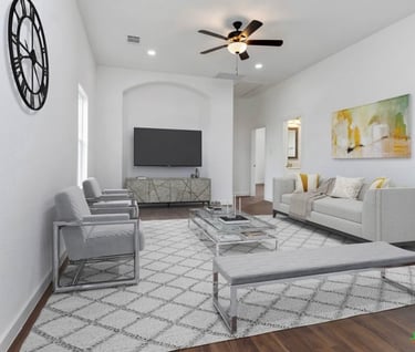 Spacious living room with vaulted ceilings and natural light in custom-built Wimberley home