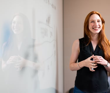 Teacher in front of a whiteboard