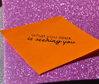 Post it reading "what you seek is seeking you"