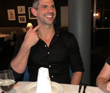Candid personal photo of Adam Bair laughing at a dinner with friends in Miami.