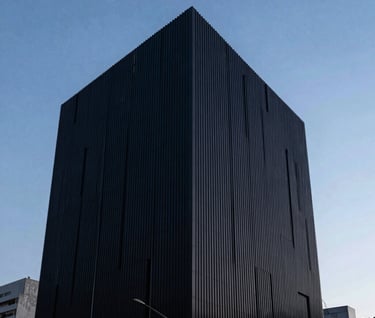 An outdoor architectural shot of a sleek, dark building facade against a baby blue twilight sky in a South American city, long exposure, clean lines and minimalist composition.