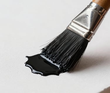 Macrophotography of a paintbrush applying deep black pigment to a pristine white canvas. The focus is sharp on the texture of the bristles and the wet paint, embodying a modern art factory aesthetic.