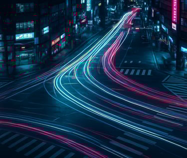 Aerial long-exposure photography of a busy intersection in an East Asian / Korean urban center. Dynamic light trails from traffic weave through a dark sophisticated landscape. The lighting is dominated by electric cyan and magenta tones.