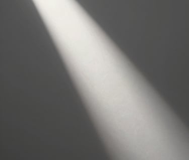 An abstract, museum-quality photographic study of light hitting a white canvas. A sharp beam of light creates a diagonal line across the off-white surface, transitioning into deep gray shadows. Sophisticated and minimalist aesthetic.