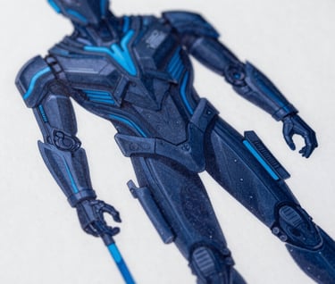 A macro photograph of a high-quality print of a character design in a North American / US studio. The print features crisp lines and a palette of dark navy blue and sky blue.