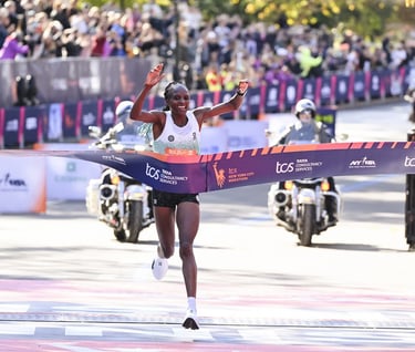 Hellen Obiri of Kenya celebrating her victory and new course record (2:19:51) immediately after crossing the finish line of t