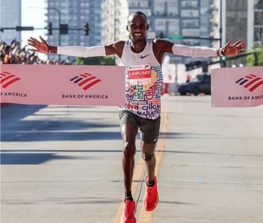 Jacob Kiplimo of Uganda raising his arms as he wins the 2025 Chicago Marathon in 2:02:23, the second-fastest time in course h