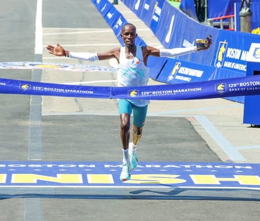 John Korir celebrating his course record victory at the 2025 Boston Marathon.