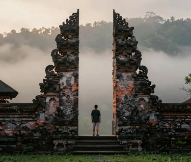 A wide, cinematic shot of a lone traveler standing before a misty Balinese water temple at dawn, serene and spiritual, dominated by deep greens #2A362B and the soft light of #F7F3EE.