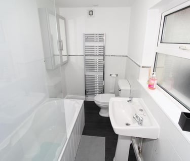 bathroom with over bath shower