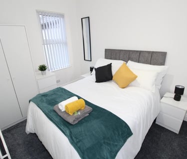 Double bedroom with white walls