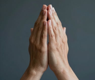 A heartfelt candid photo of hands folded in prayer, captured with artistic depth and soft focus. The skin tones are warm against a deep #1A2F3C background, creating a mood of serenity and devotion. Professional photography style.