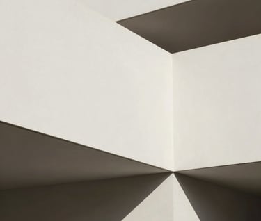 An abstract, minimalist architectural detail of a modern Spanish gallery with off-white walls and sharp charcoal gray shadows. Clean geometric composition, elegant and sophisticated feel.