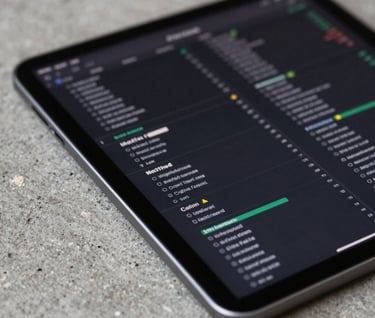 Close-up of a tablet displaying complex data, resting on a rough concrete surface. Contrast between tech and raw materials. Colors: #1A1A1A and #F5F5DC.
