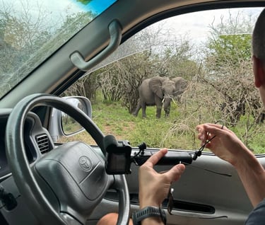 a man in a car with a camera 