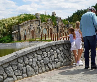 Fish Market themed zone with custom scenic bridges and stonework by Artisan Aleks Company