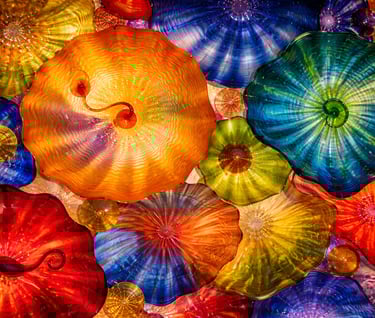 Colorful blown glass objects overlapping like jelly fish
