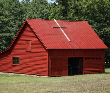 an old US barn restored with a rustic red barn color