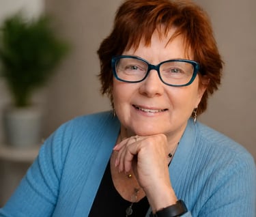 a senior red hair lady with glasses, named Suzie Docherty from KCR community resources