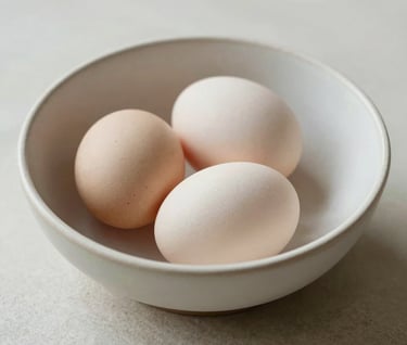 Still life painting of a ceramic bowl containing three eggs, arranged with minimalist precision. The scene is bathed in soft, natural light, using a palette of soft off-white and warm stone tones.