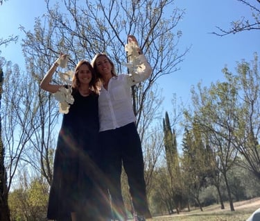 a man and woman standing in a park