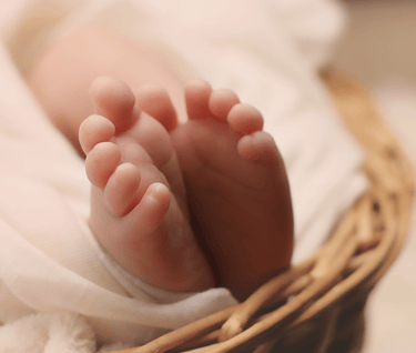 a baby toes in basket