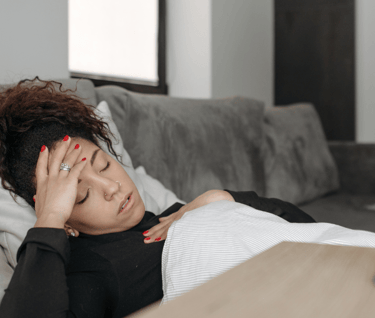 sick women lying on bed