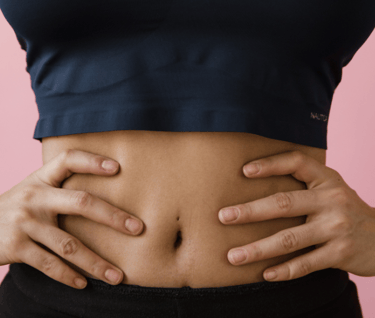 a women holding- belly
