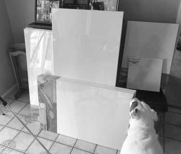 Some of my canvases. (That's my pup Jasper photobombing!)