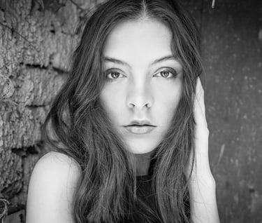 a woman with long hair and a black dress