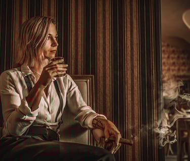 a woman sitting in a chair with a cigar and a cigar