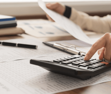 accountant hand calculation on calculator