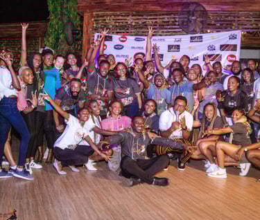 a group of people standing around a wooden floor