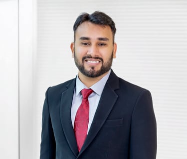 a man in a suit and tie smiling